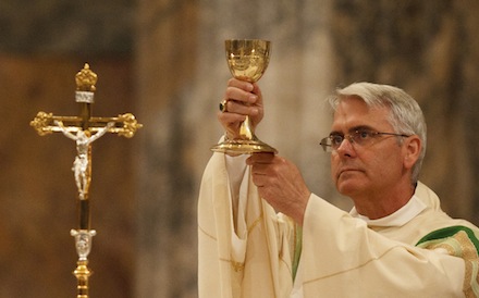 ARCHBISHOP COAKLEY ELEVATES CHALICE DURING MASS AT BASILICA OF ST. PAUL OUTSIDE THE WALLS IN ROME